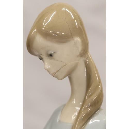 37 - 2 Lladro figurines; a Dutch boy carrying pails, 22cm high and a young girl holding a lamb, 27cm high... 