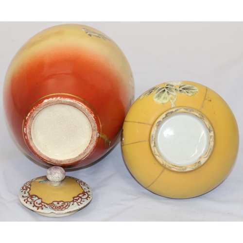26 - A Satsuma round bulbous lidded ginger jar on yellow and red ground with bird, floral and bamboo deco... 