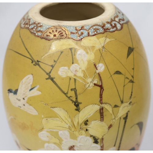 26 - A Satsuma round bulbous lidded ginger jar on yellow and red ground with bird, floral and bamboo deco... 