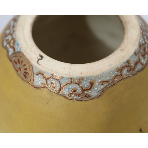 26 - A Satsuma round bulbous lidded ginger jar on yellow and red ground with bird, floral and bamboo deco... 
