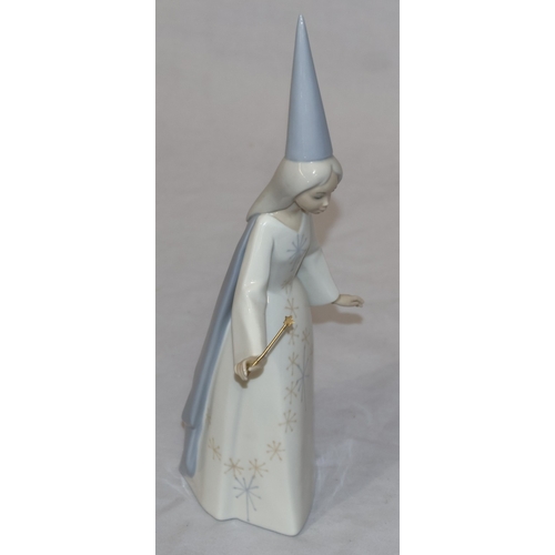 58 - A Lladro figure of a Sorceress holding a wand with spiked hat, 27cm high