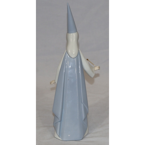 58 - A Lladro figure of a Sorceress holding a wand with spiked hat, 27cm high