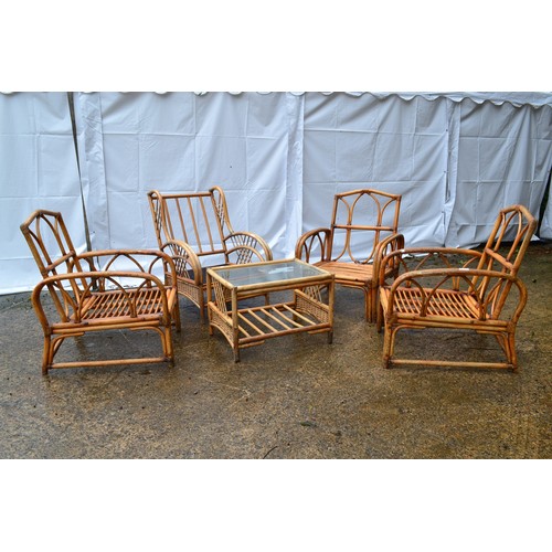 65 - A Set Of Four Conservatory Chairs With Glass Topped Table