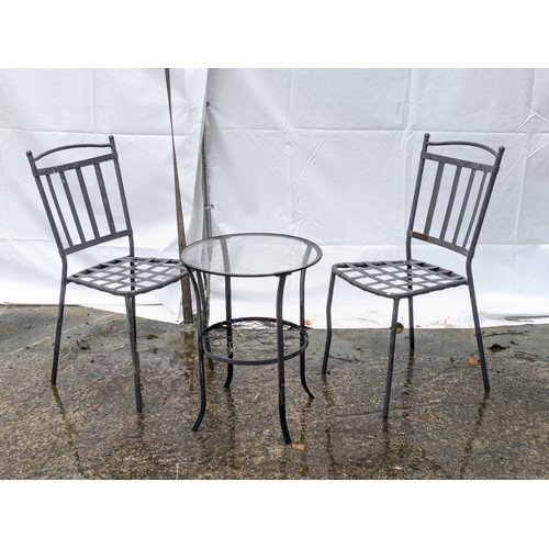 24 - A Metal Glass Topped Bistro Table And 2 Chairs Set