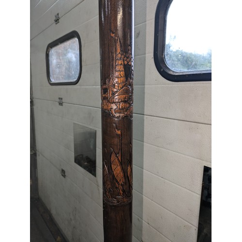 66 - An Ornate Freestanding Lamp With Various Carvings