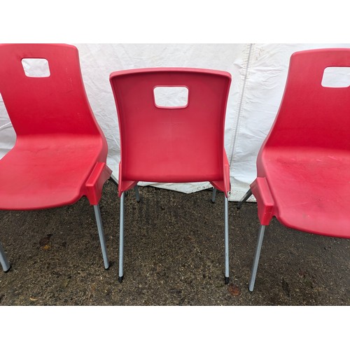 100 - A Set Of 5 Red Plastic Chairs