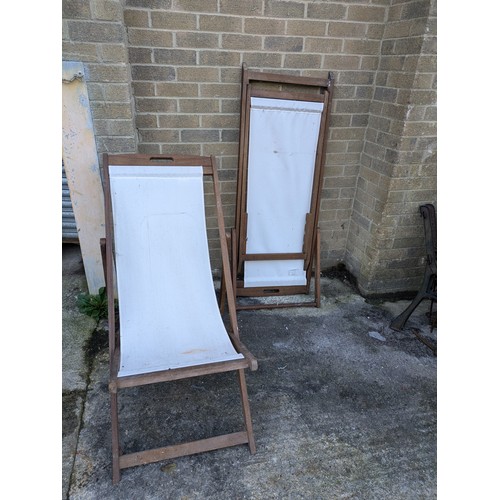 23 - a pair of 2 wood sun loungers