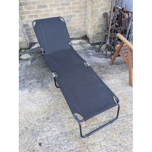 22 - a black sun lounger