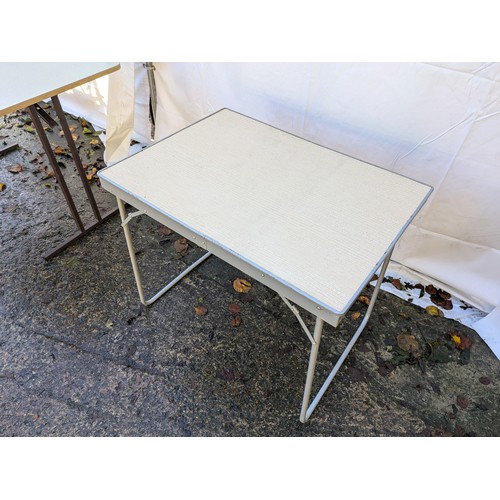 105 - A pair of collapsible tables