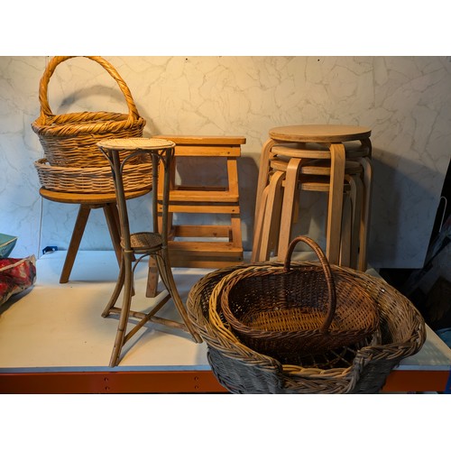 93 - a selection of 7 wooden stools and a variety of wicker baskets