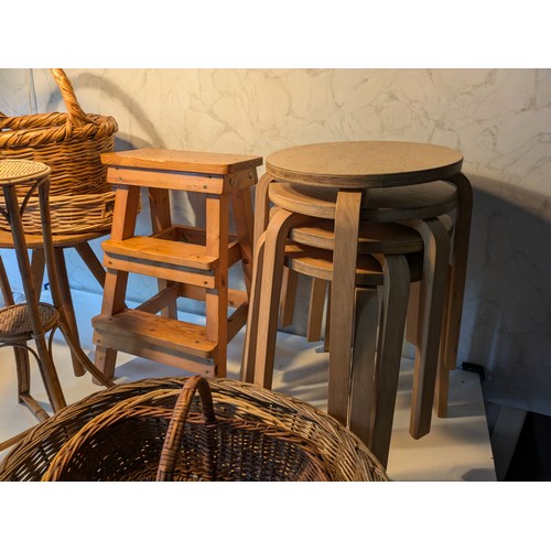 93 - a selection of 7 wooden stools and a variety of wicker baskets