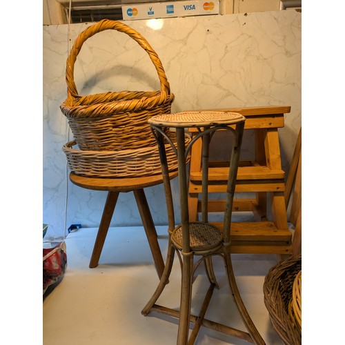 93 - a selection of 7 wooden stools and a variety of wicker baskets