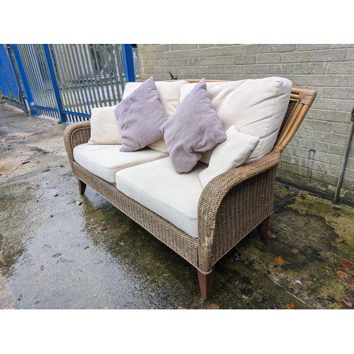 112 - A Leekes Wicker Conservatory Sofa With Pillows