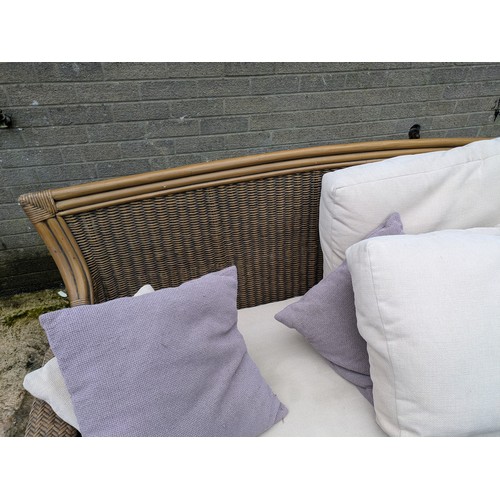 112 - A Leekes Wicker Conservatory Sofa With Pillows