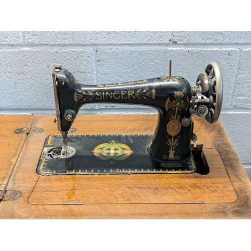 118 - A Singer 99K Foot Operable Sewing Machine In Cabinet