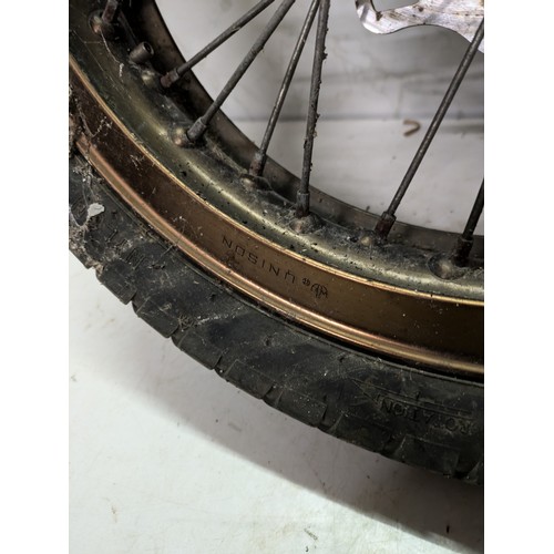 1 - A Spoked Motorcycle Wheel With Tyre