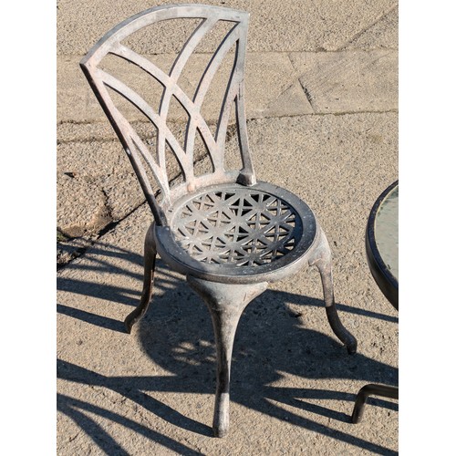 89 - An Aluminium Bistro Set Including 2 Chairs And A Glass Topped Table