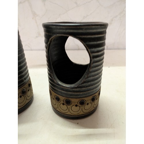 560 - A Pair Of Jersey Pottery Candle Holders