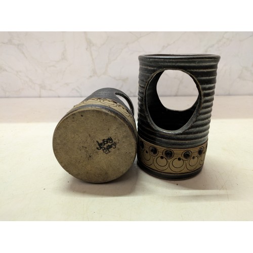 560 - A Pair Of Jersey Pottery Candle Holders