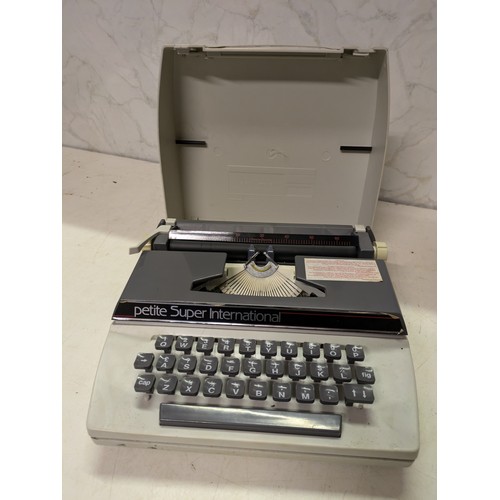 563 - A Petite Super International Typewriter In Case