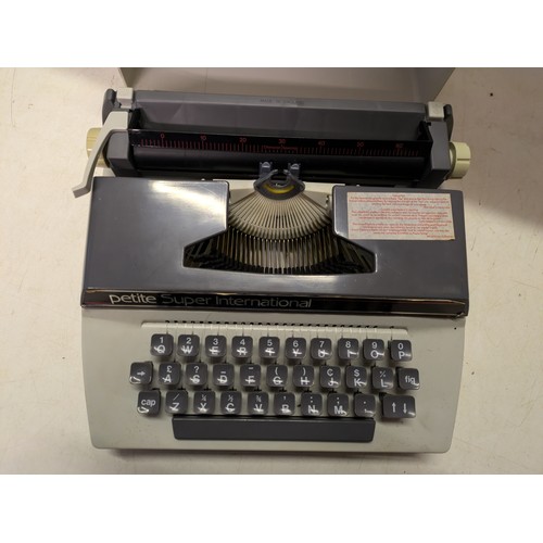 563 - A Petite Super International Typewriter In Case