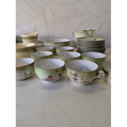 567 - A Large Selection Of Green And White Porcelain Crockery