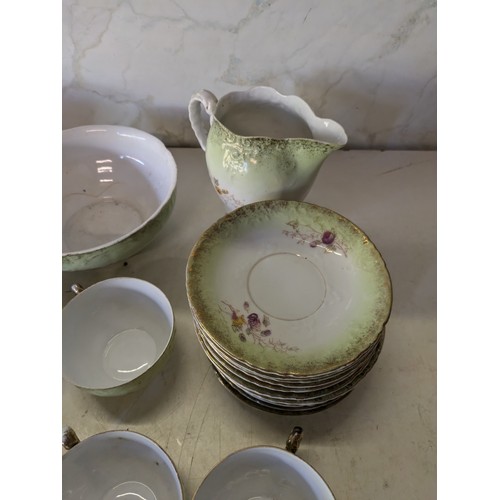 567 - A Large Selection Of Green And White Porcelain Crockery