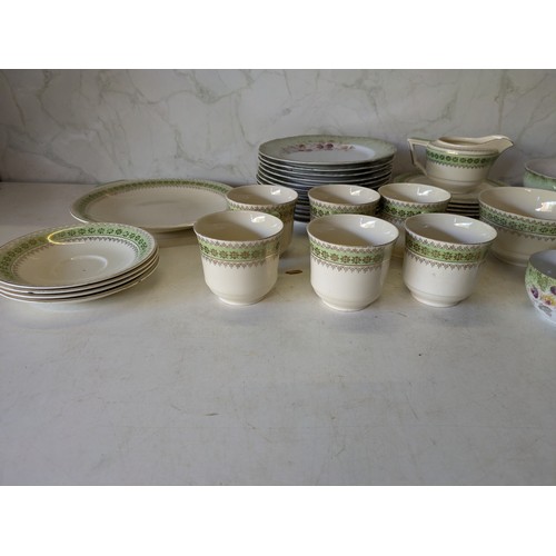 567 - A Large Selection Of Green And White Porcelain Crockery