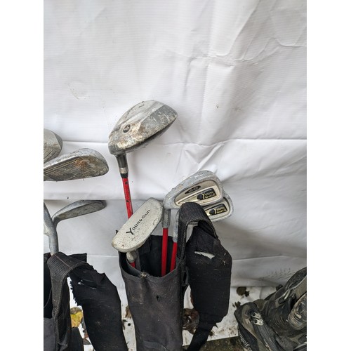 586 - A Selection Of Golf Clubs In Bags