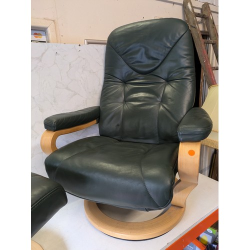 136 - a Himolla (stressless style) green leather reclining chair with foot stool