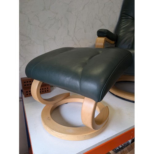 136 - a Himolla (stressless style) green leather reclining chair with foot stool