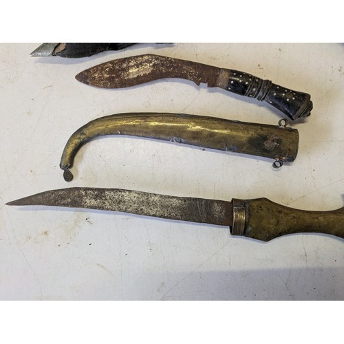 421 - 3 various swords in sheaths including an Indian Kukri knife