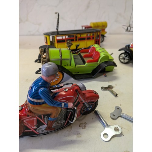 388 - a selection of tin plate toys