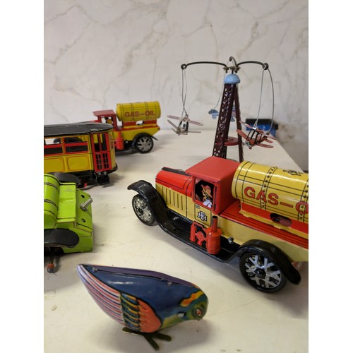 388 - a selection of tin plate toys