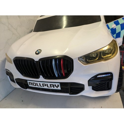 29 - a rollplay police BMW battery children's car with charger - working