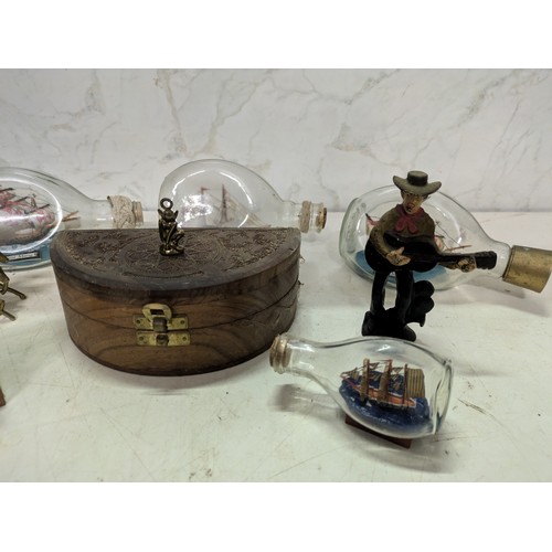 522 - a selection of trinkets including ships in bottles and a brass horse and carriage