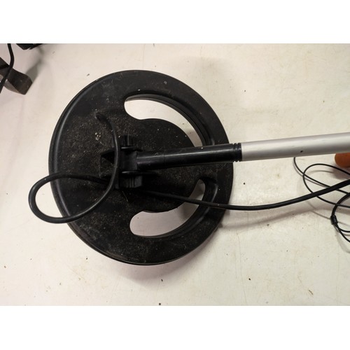 239 - a metal detector with headphones - working