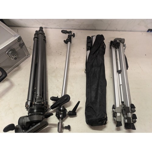 489 - a selection of camera tripods and travel case