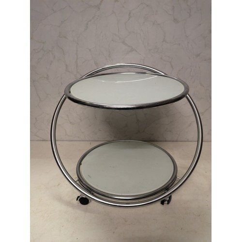 123 - a glass topped chrome table with castors