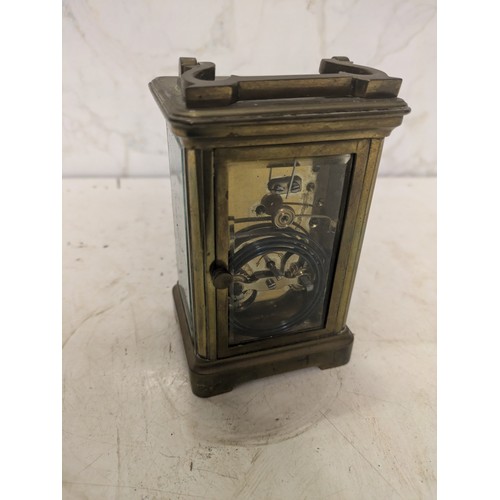 197 - antique brass carriage clock with an engraving from 1916