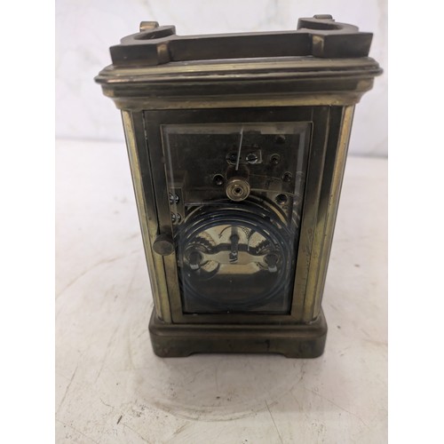 197 - antique brass carriage clock with an engraving from 1916