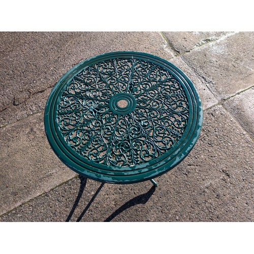 77 - a green metal outdoor bistro table