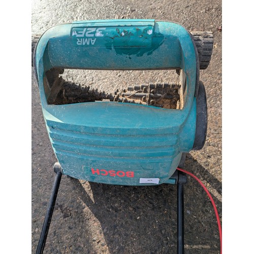 626 - a Bosch arm 32 f electric lawn Raker