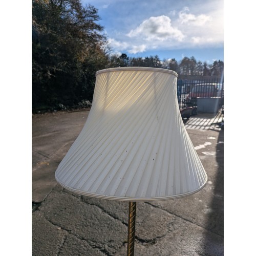 117 - a gold floor lamp