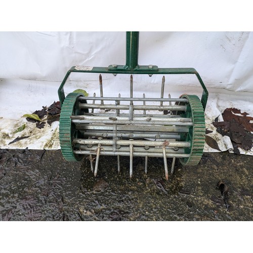 25 - a push along lawn scarifier