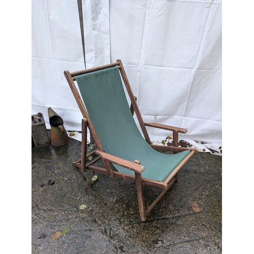 8 - a green fabric wooden deck chair