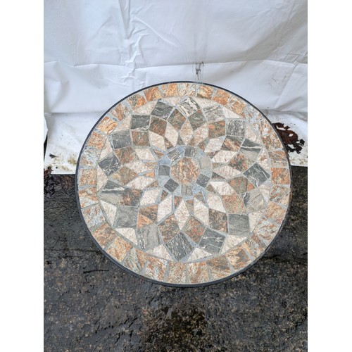 101 - a decorative tiled top metal framed table