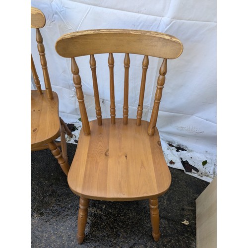 99 - a Pair of wooden dining chairs