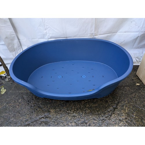 375 - a blue plastic dog bed