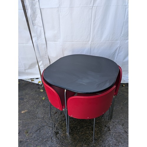 126 - a retro table and 4 chair set with red vinyl seats